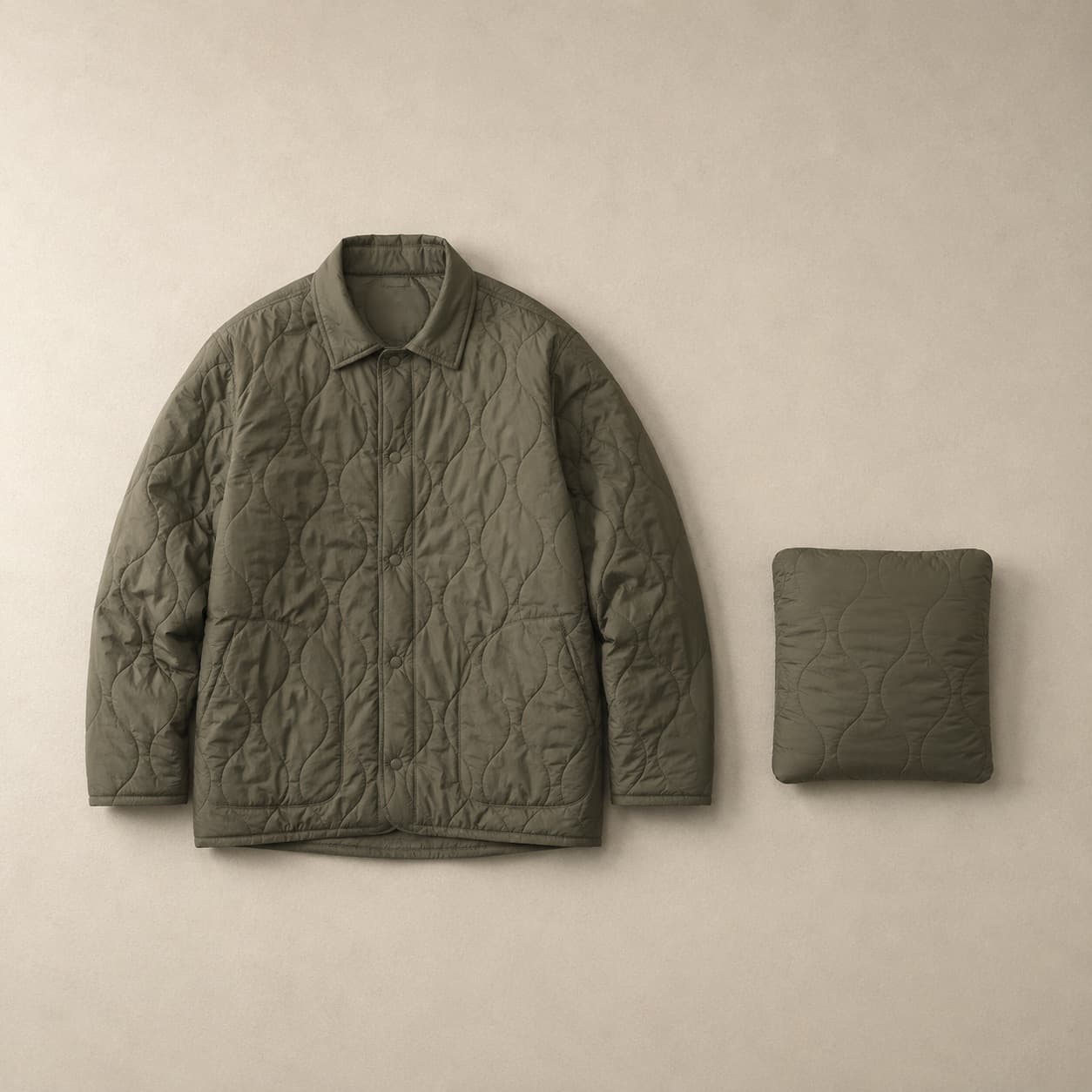 Olive lightly quilted jacket laid flat next to the same jacket folded into its pocket.